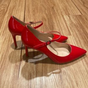 Red pointed toe stiletto heels with ankle strap